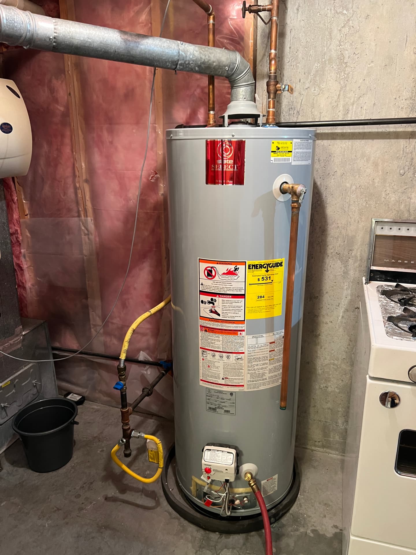 New gas hot water tank installed with clean copper piping and venting